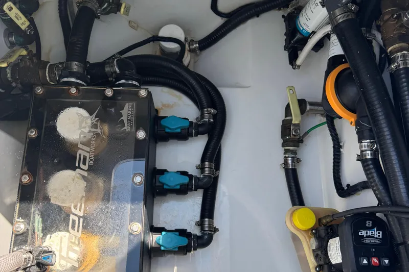 Slide: The Image of Engine compartment of a 2024 Freeman 28 boat, showcasing wiring and components. - 39