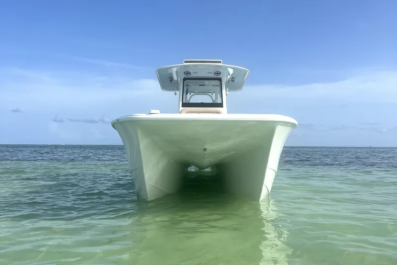 Slide: The Image of 2024 Freeman 28 boat on clear ocean water under blue sky. - 4