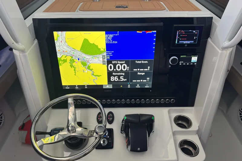 Slide: The Image of Dashboard of a 2024 Freeman 28 boat with navigation and control systems. - 6