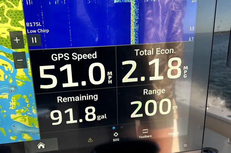 Slide: The Image of Boat dashboard display showing GPS speed, fuel economy, and range on a 2024 Freeman 28. - 7