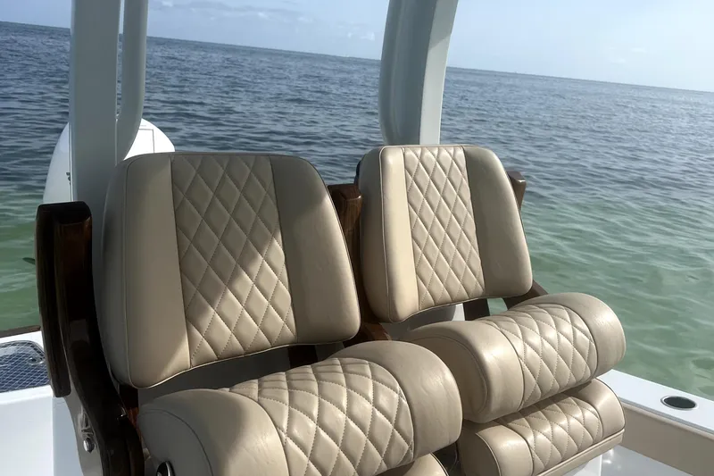 Slide: The Image of Luxurious seating on 2024 Freeman 28 boat with ocean backdrop. - 8
