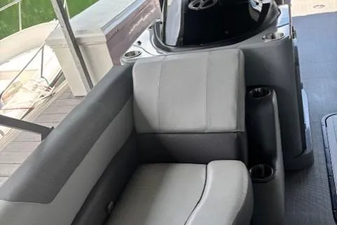 Slide: The Image of 2023 Veranda Relax VR22RC boat interior with gray seating and steering console. - 17