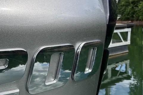 Slide: The Image of 2023 Veranda Relax VR22RC boat detail with metallic finish near water. - 18