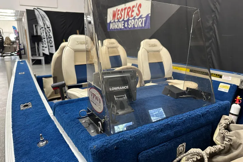 Slide: The Image of 1997 Sylvan 16 Super Select boat interior with Lowrance device and seating at Westre's Marine & Sport. - 11