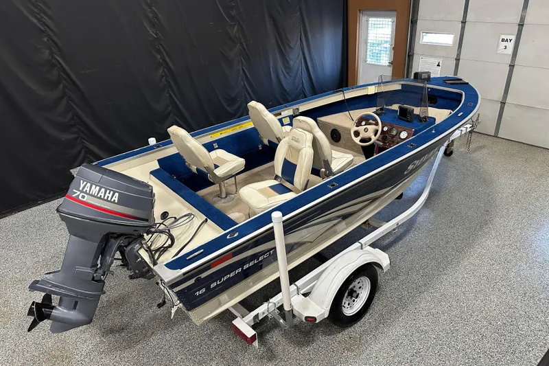 Slide: The Image of 1997 Sylvan 16 Super Select boat with Yamaha 70 outboard motor on trailer. - 14