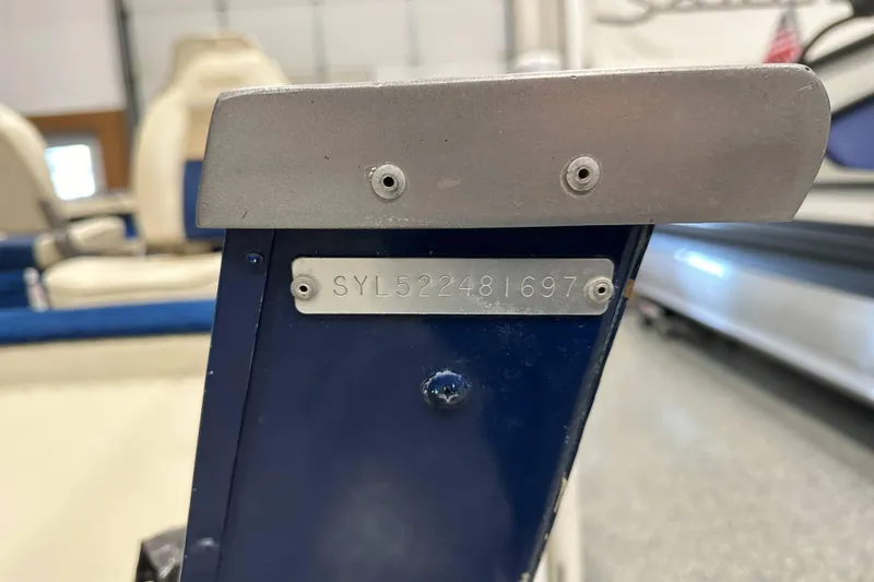 Slide: The Image of 1997 Sylvan 16 Super Select boat with visible serial number plate. - 16