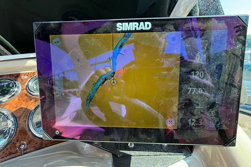 Slide: The Image of Simrad navigation display on 2004 Sea Ray 260 Sundancer boat dashboard. - 14