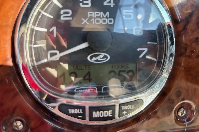 Slide: The Image of Close-up of a 2004 Sea Ray 260 Sundancer tachometer showing RPM and voltage. - 19
