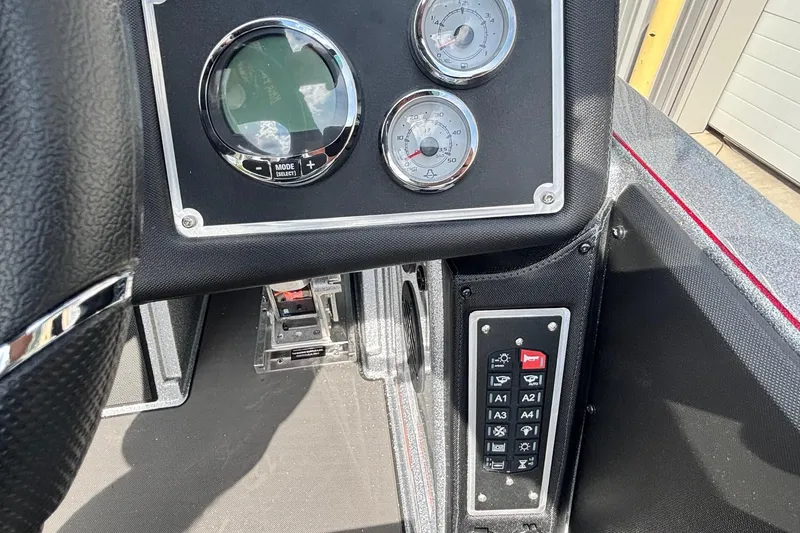 Slide: The Image of Dashboard of 2025 Ranger Z520R boat with gauges and control panel. - 10