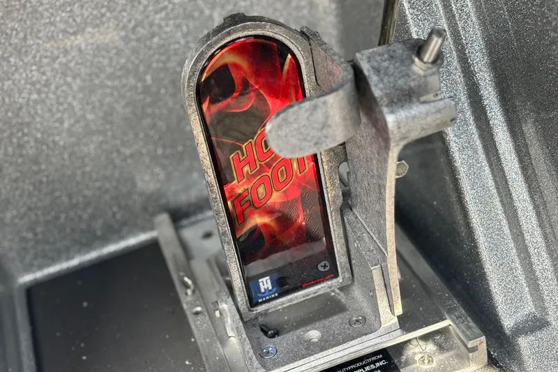 Slide: The Image of Close-up of a 2025 Ranger Z520R boat pedal with "Hot Foot" branding. - 11