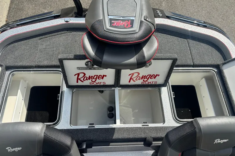Slide: The Image of 2025 Ranger Z520R boat interior with storage compartments and branded seats. - 14