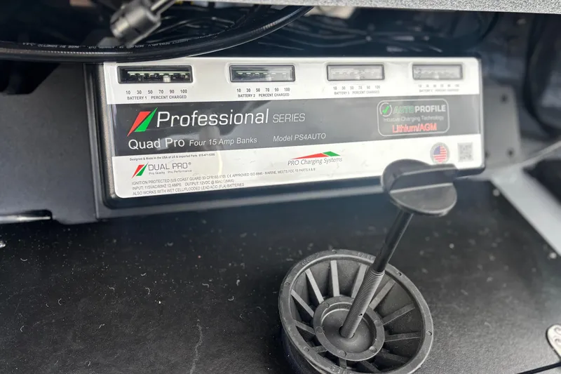 Slide: The Image of Battery charger in a 2025 Ranger Z520R, featuring Quad Pro 15 Amp banks. - 15