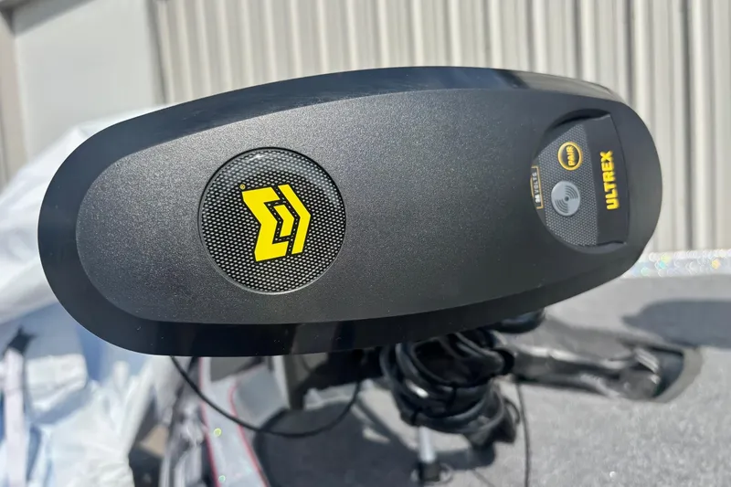 Slide: The Image of Close-up of Ultrex motor on 2025 Ranger Z520R boat, featuring control panel and logo. - 3