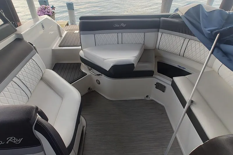 Slide: The Image of 2017 Sea Ray SLX 230 boat interior with elegant seating and modern design. - 12