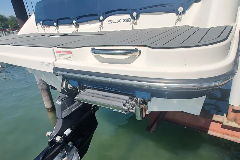 Slide: The Image of 2017 Sea Ray SLX 230 boat stern with swim platform and outboard motor. - 6
