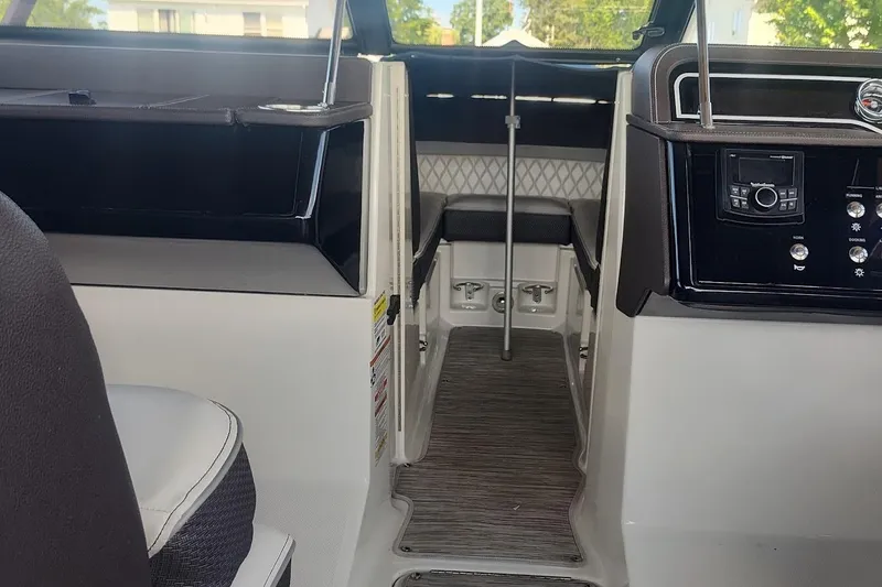 Slide: The Image of Interior view of a 2017 Sea Ray SLX 230 boat cockpit with modern controls. - 8