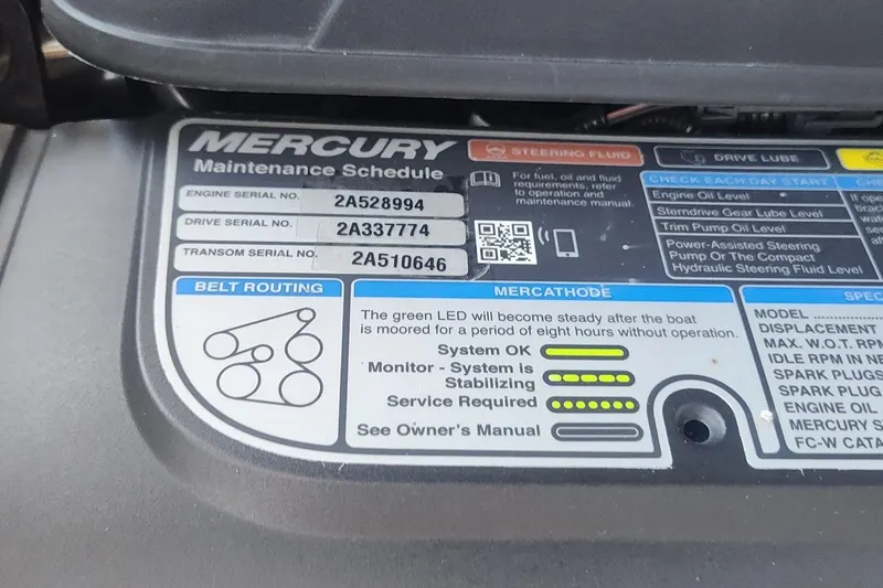 Slide: The Image of Engine maintenance schedule label on a 2017 Sea Ray SLX 230 boat. - 9