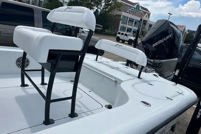 Slide: The Image of 2026 Yellowfin 24 CE boat console with steering wheel and controls, featuring modern design. - 12