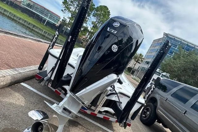 Slide: The Image of 2026 Yellowfin 24 CE boat in a spacious indoor storage facility. - 8