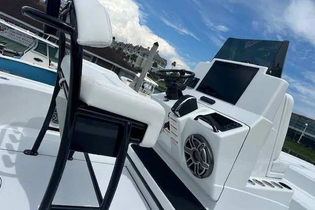 Slide: The Image of 2026 Yellowfin 24 CE boat with Mercury engine, parked on a trailer. - 9