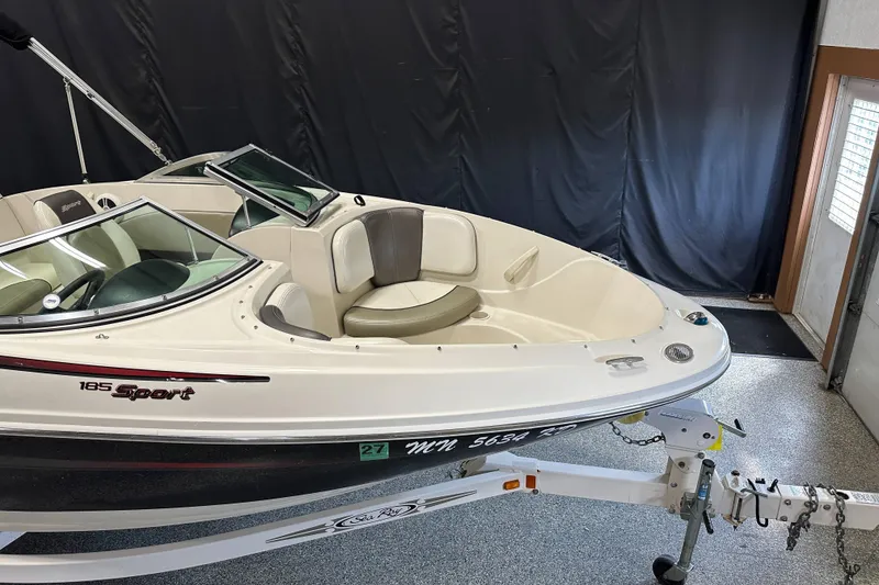 Slide: The Image of Steering wheel and dashboard of 2007 Sea Ray 185 Bow Rider boat. - 11