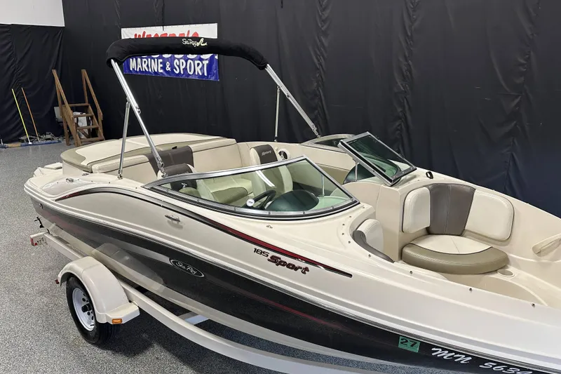 Slide: The Image of 2007 Sea Ray 185 Bow Rider interior with steering wheel and dashboard controls. - 12