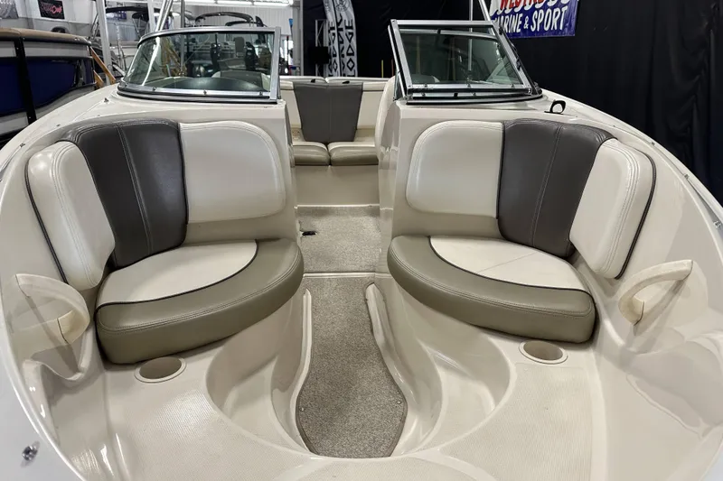 Slide: The Image of 2007 Sea Ray 185 Bow Rider dashboard with steering wheel and control panel. - 16