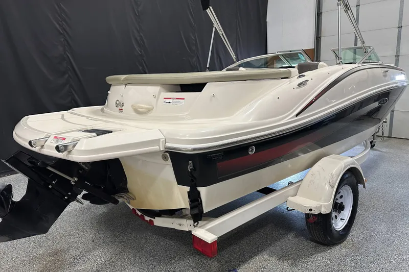 Slide: The Image of 2007 Sea Ray 185 Bow Rider boat on trailer in indoor setting. - 3