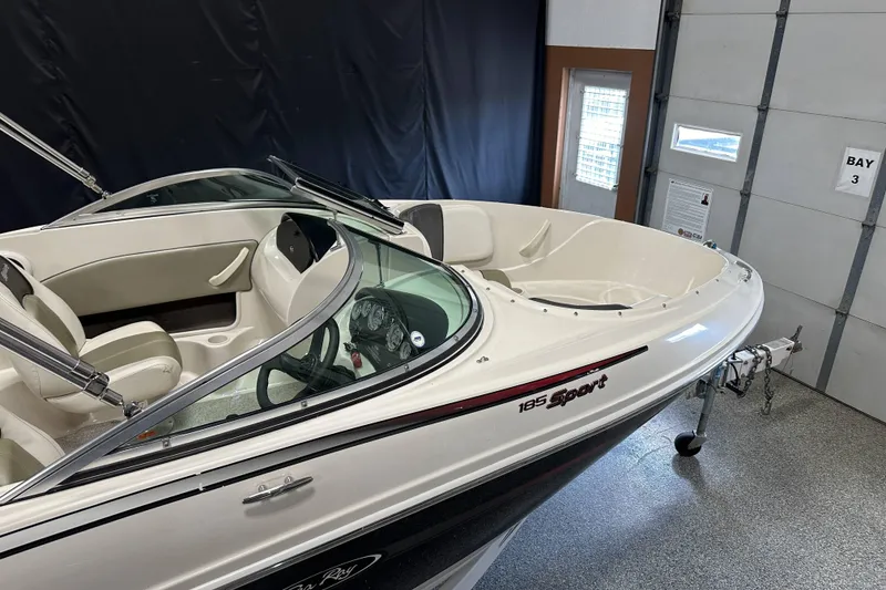 Slide: The Image of 2007 Sea Ray 185 Bow Rider boat on trailer in showroom. - 8