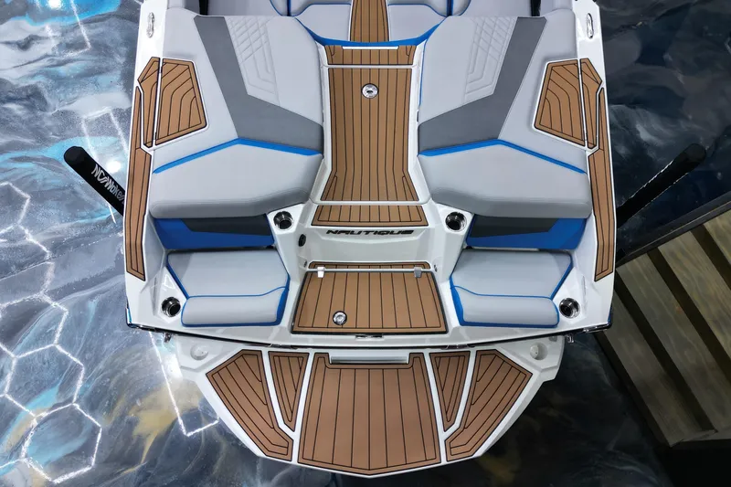 Slide: The Image of 2022 Nautique Super Air Nautique G23 boat with sleek seating and teak-style decking. - 13