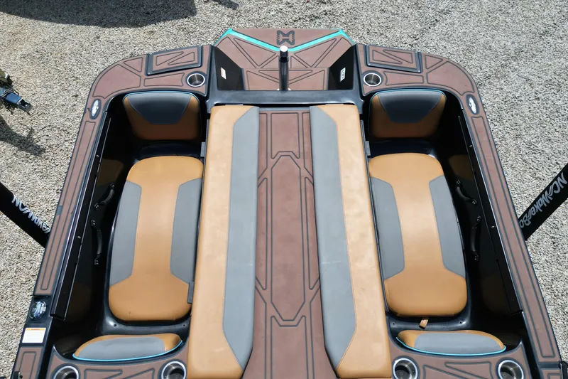 Slide: The Image of 2022 Heyday WTSurf boat interior with brown and gray seating, viewed from above. - 10