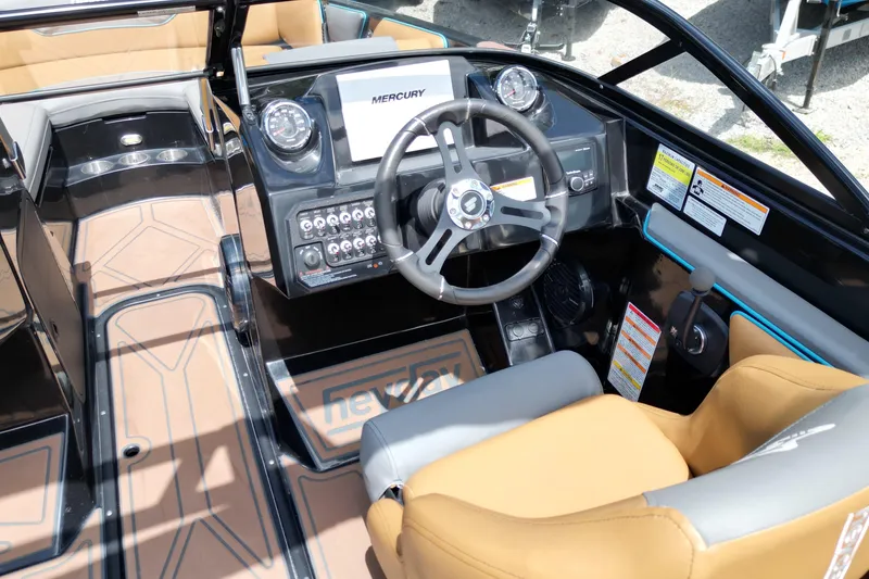 Slide: The Image of Interior of 2022 Heyday WTSurf boat with steering wheel and control panel. - 7