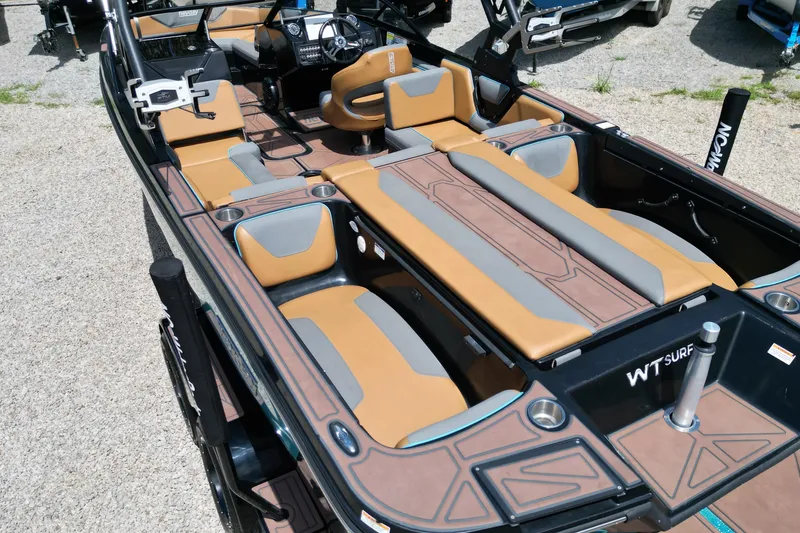 Slide: The Image of 2022 Heyday WTSurf boat interior with tan and gray seating, showcasing modern design. - 9