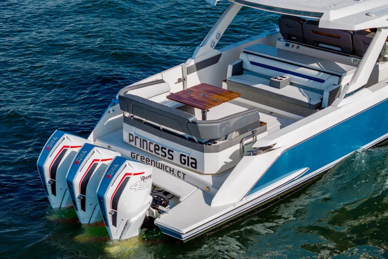 Slide: The Image of 2021 Tiara Yachts 43 LS with triple outboard engines on the water. - 11