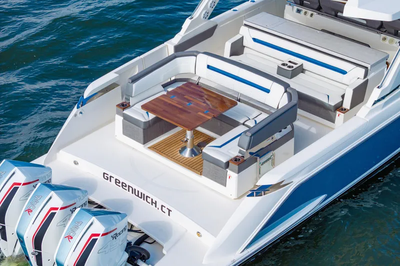 Slide: The Image of 2021 Tiara Yachts 43 LS with elegant seating and table on deck, Greenwich, CT. - 12