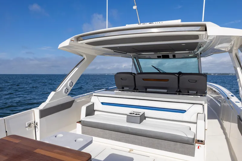 Slide: The Image of 2021 Tiara Yachts 43 LS luxury boat interior with seating, ocean view. - 17