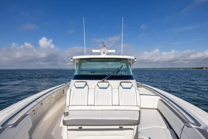 Slide: The Image of 2021 Tiara Yachts 43 LS on open water, showcasing sleek design and luxury seating. - 23