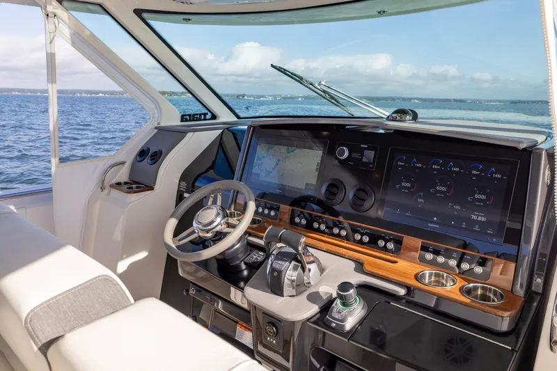 Slide: The Image of 2021 Tiara Yachts 43 LS helm with advanced navigation displays and controls. - 26