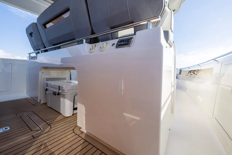Slide: The Image of 2021 Tiara Yachts 43 LS interior with seating and storage area. - 29