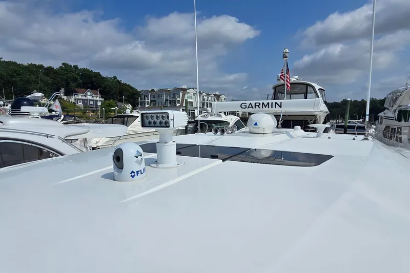 Slide: The Image of 2021 Tiara Sport 43 LS yacht with advanced navigation equipment docked at marina. - 34