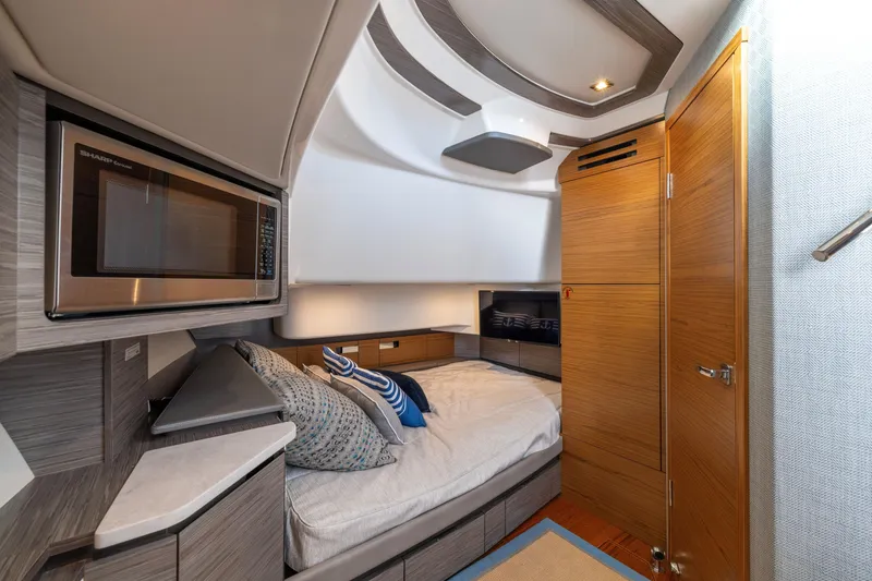 Slide: The Image of Luxurious interior of 2021 Tiara Yachts 43 LS, featuring a cozy cabin with modern amenities. - 35