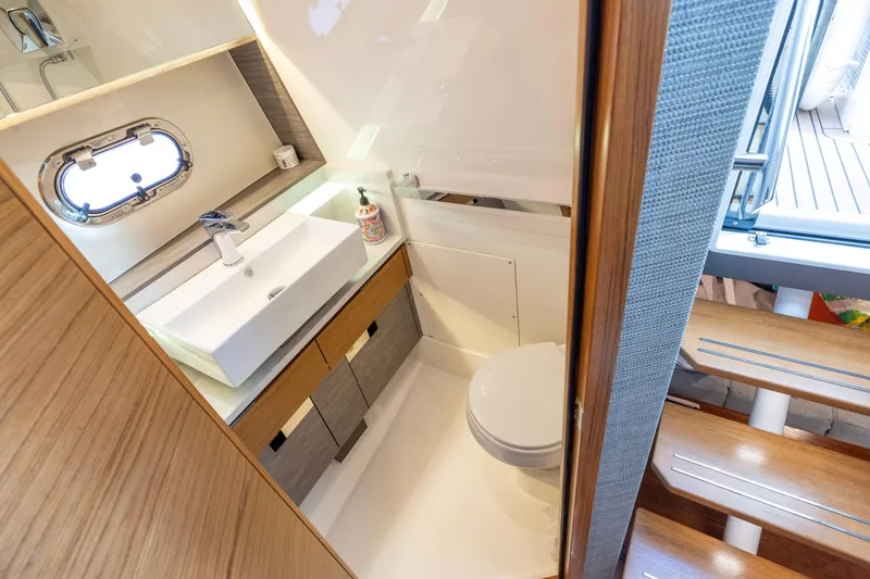Slide: The Image of Luxurious bathroom interior of 2021 Tiara Yachts 43 LS, featuring modern sink and toilet. - 40