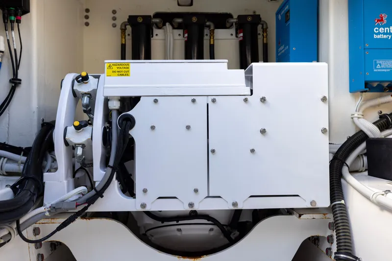 Slide: The Image of Engine compartment of 2021 Tiara Yachts 43 LS, featuring electrical components and wiring. - 47