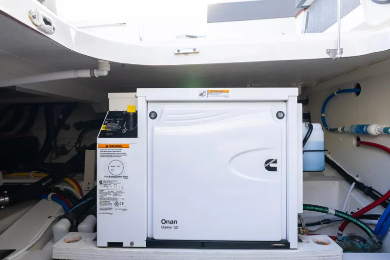 Slide: The Image of Engine compartment of 2021 Tiara Yachts 43 LS with Onan Marine generator. - 48