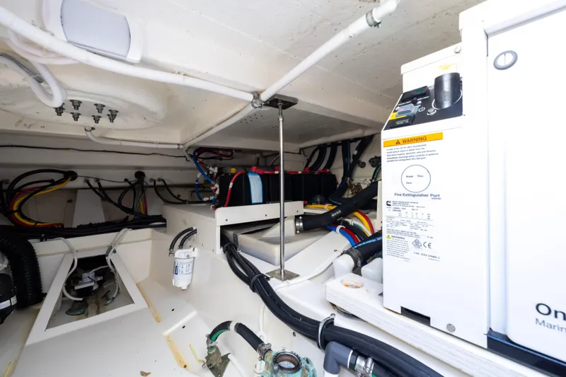 Slide: The Image of Engine room of 2021 Tiara Yachts 43 LS, showcasing wiring and equipment. - 50