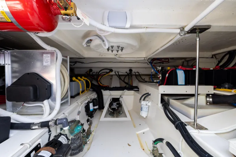 Slide: The Image of Engine room of 2021 Tiara Yachts 43 LS, showcasing wiring and equipment layout. - 51