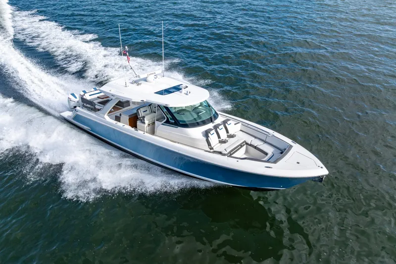 Slide: The Image of 2021 Tiara Yachts 43 LS cruising on open water, showcasing sleek design and performance. - 6
