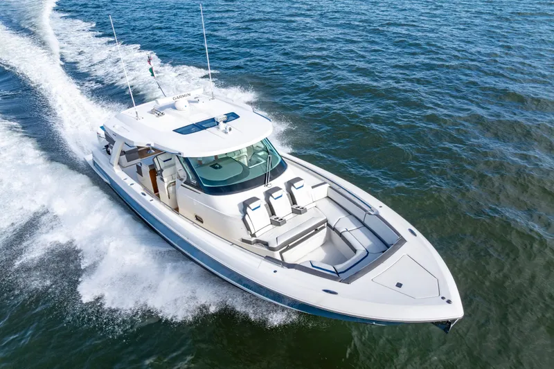 Slide: The Image of 2021 Tiara Yachts 43 LS cruising on open water, showcasing sleek design and performance. - 7