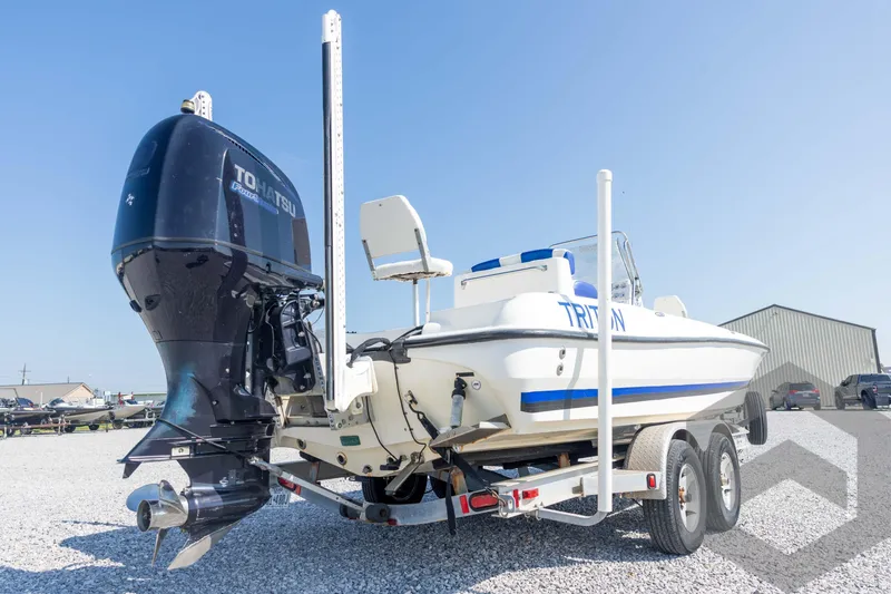 Slide: The Image of 2008 Triton 240 LTS boat on trailer with Tohatsu outboard motor. - 15