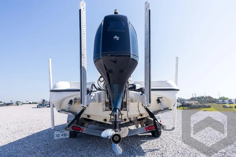 Slide: The Image of Rear view of a 2008 Triton 240 LTS boat with outboard motor. - 19